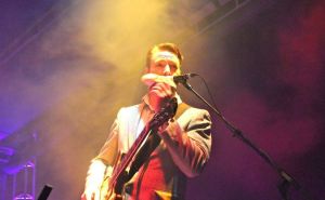 Eddie Roberts playing around with a stuffed weasel that was thrown on stage